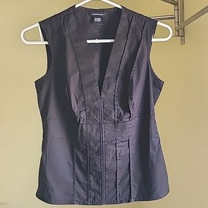 Black sleeveless blouse with snap closures. Size small